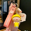 Cute pink pig riding a yellow motorcycle keychain with silicone hand strap and metal clasp - Motorcycle Style (QX-1-453) / OPP Bag Packaging
