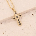 Detailed view of a gold cross pendant with black zircon stones on a minimalist chain - Standard Cross (Small) / 4# Black