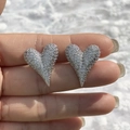 Close-up of heart-shaped silver earrings with micro-pave sparkling crystals - Large Silver