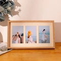 Three-window natural wood photo frame with beige matting on a cozy wooden desk - Triple Frame Flat Style / Natural Wood Color