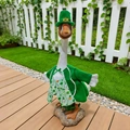 Close-up of St. Patrick's Day porch goose outfit with a green hat and vest for garden decor - St. Patrick's Day A