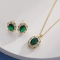 Detail of emerald green jewelry set with gold necklace and stud earrings on pedestal - Gold Oval Emerald Green (HQ0001(1))