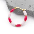 Detail of bamboo joint earrings with red and pink enamel beads and gold plating - Pinkish Red