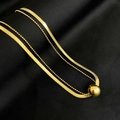 Detail of 18K gold double layer snake chain and bead necklace on black silk - Round Bead Layered Necklace / Gold