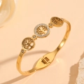 Detailed close-up of 18K gold-plated Tree of Life bangle with sparkling white rhinestones - Multiple Tree of Life with Single Rhinestone Style (H221)