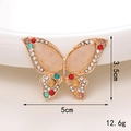 Dettaglio charm a farfalla con dimensioni 5cm x 3.5cm e strass multicolori scintillanti - D604 Farfalla marquise grande