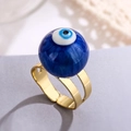 Macro view of adjustable gold-plated evil eye ring with blue enamel bead and polished finish - Adjustable Open / Dark Blue (13419)