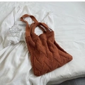 Detail view of brown cable-knit texture on a spacious commute tote bag in a cozy setting - Brown (163)