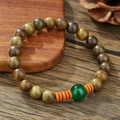 Handmade wooden beaded bracelet featuring brown beads and a green turquoise accent bead - ZJ14820-Brown Wood Orange Slice Green Bead Bracelet