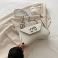 Sparkling white sequin evening bag with silver bow clasp and elegant chain strap - White
