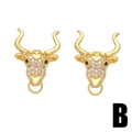 Golden bull head stud earrings with white cubic zirconia accents on a clean white background - B-Zirconia Bull Head