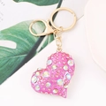 Detailed close-up of pink crystal heart keychain with sparkling rhinestones and gold clasp - Full Rhinestone Pink Iridescent Heart