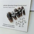 Macro shot of 50pcs 3x4mm teardrop shaped crystal rhinestones for 3D nail art design - White Teardrop 3x4 (XY-1001)