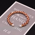 Handmade gold wire-wrapped bracelet with red faceted beads and white freshwater pearls - Gold Red Stone Pearl Style