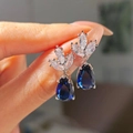 Blue pear-shaped drop earrings with marquise-cut clear stones in a silver-tone setting - Sapphire Blue Diamond Teardrop Earrings Led-91