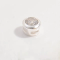 Macro detail of silver round bezel setting with clear cubic zirconia and side hollow design - Silver Round Bead