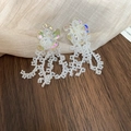 Close-up of iridescent flower earrings with white bead tassels on a textured fabric - Silver Post Style (93#) / White