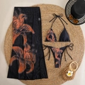 Detail of floral print bikini set with matching black and orange mesh beach cover-up skirt - Chrysanthemum 3-Piece Set