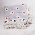Detail of gray cotton baby blanket with white daisy patterns and cream fringe trim - Custom Size / Daisy