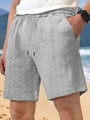 Detail of light gray men's beach shorts showing drawstring waist and herringbone texture - Marl Grey