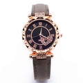 Detail of rose gold watch face featuring Roman numerals and a sparkling heart crystal insert - Gray