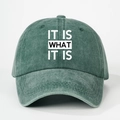 Close-up of washed green denim baseball cap with white IT IS WHAT IT IS printed text - One Size(Adjustable) / Washed Dark Green