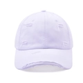 Detail of distressed vintage baseball cap showing frayed holes and cotton twill texture - White