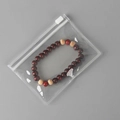Transparent PVC storage bag containing red-brown and beige wooden beaded bracelet - 25 Micron 11x9cm Zipper / 100 Pcs/Pack