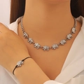 Detail of elephant necklace and bracelet set featuring textured silver pendants - Elephant Necklace And Bracelet Set / Silver