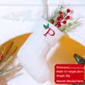 White knit Christmas stocking with embroidered letter P and holly leaf decoration - Letter P / White