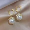 Elegant gold earrings with sparkling zircon crystals and large hanging white pearls - White