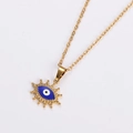 Detailed close-up of a gold oval starburst pendant featuring a blue Evil Eye enamel charm - Gold Evil Eye
