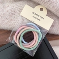 Set of five pastel elastic hair ties in pink, blue, green, beige, and purple colors - Twill Style