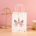 White unicorn paper gift bag with gold glitter horn and pink floral crown detail - NF-Y140 Star Eyes Closed