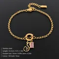 Elegant 14K gold plated stainless steel bracelet with letter S and pink crystal pendant - Letter S
