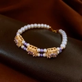 Detail of beaded bracelet with white pearls, purple crystals and gold-set square stones - 1# Bracelet-Gold-Blue