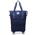Expandable dark blue nylon travel bag with four spinner wheels and waterproof dual handles - Dark Blue