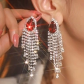 Elegant long fringe earrings with a red teardrop gemstone and sparkling silver tassels - Silver Rhinestone Tassel Ruby