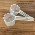 Transparent plastic measuring spoons with clear 5ml to 20ml graduated scale markings - Transparent (9.2*3.5*2.8cm) / 10g (20ml) with Scale / Clear