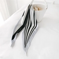 Minimalist black and white striped long silk scarf tied on a white handbag handle - Black Stripe