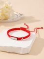 Detail view of red braided bracelet with silver metal plate on a textured stone - Red (Silver Plate)