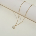 Retro stainless steel necklace with gold M letter pendant and pearl inlay for women - Letter M