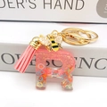 Detail of pink resin letter R keychain with sequins, bee charm and leather tassel - Letter R Bee Keychain