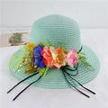 Detail of mint green straw sun hat decorated with colorful floral accents and black ribbon - M (56-58cm) With Wind Rope / Aqua Green