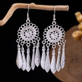 Silver vintage ethnic earrings featuring peacock leaf tassels and intricate hollow carving - Silver Disc Leaf Tassel(E5774-2)
