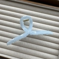 Detail of light blue marble acetate hair claw clip with golden spring and cloud pattern - Blue Cross 13cm