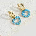 Ethnic heart earrings in sky blue enamel with colorful zircons on stone background - Blue
