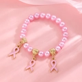 Pink pearl bracelet with breast cancer awareness ribbons on elegant silk fabric - Gold Triple Pendant Pink Ribbon Bracelet (G-525)