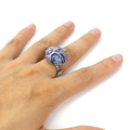 Detailed shot of handmade silver wire-wrapped tree of life ring with a blue gemstone bead - Blue Sodalite