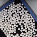 Multiple 4mm loose white freshwater pearls with high luster in a black velvet jewelry box - Approx 4mm/Half Drilled / Natural White